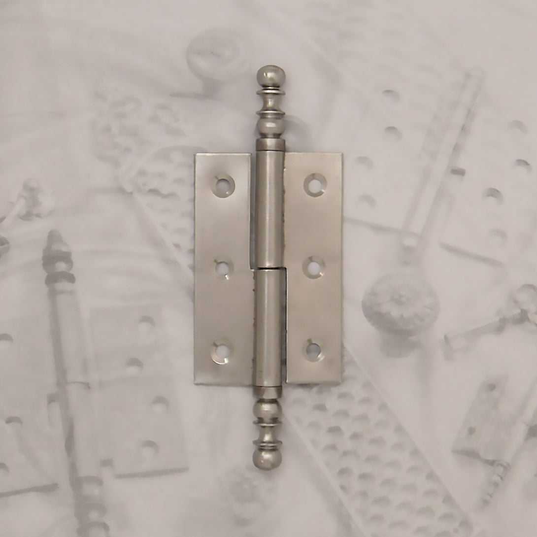 Decorative hardware hinge with finials