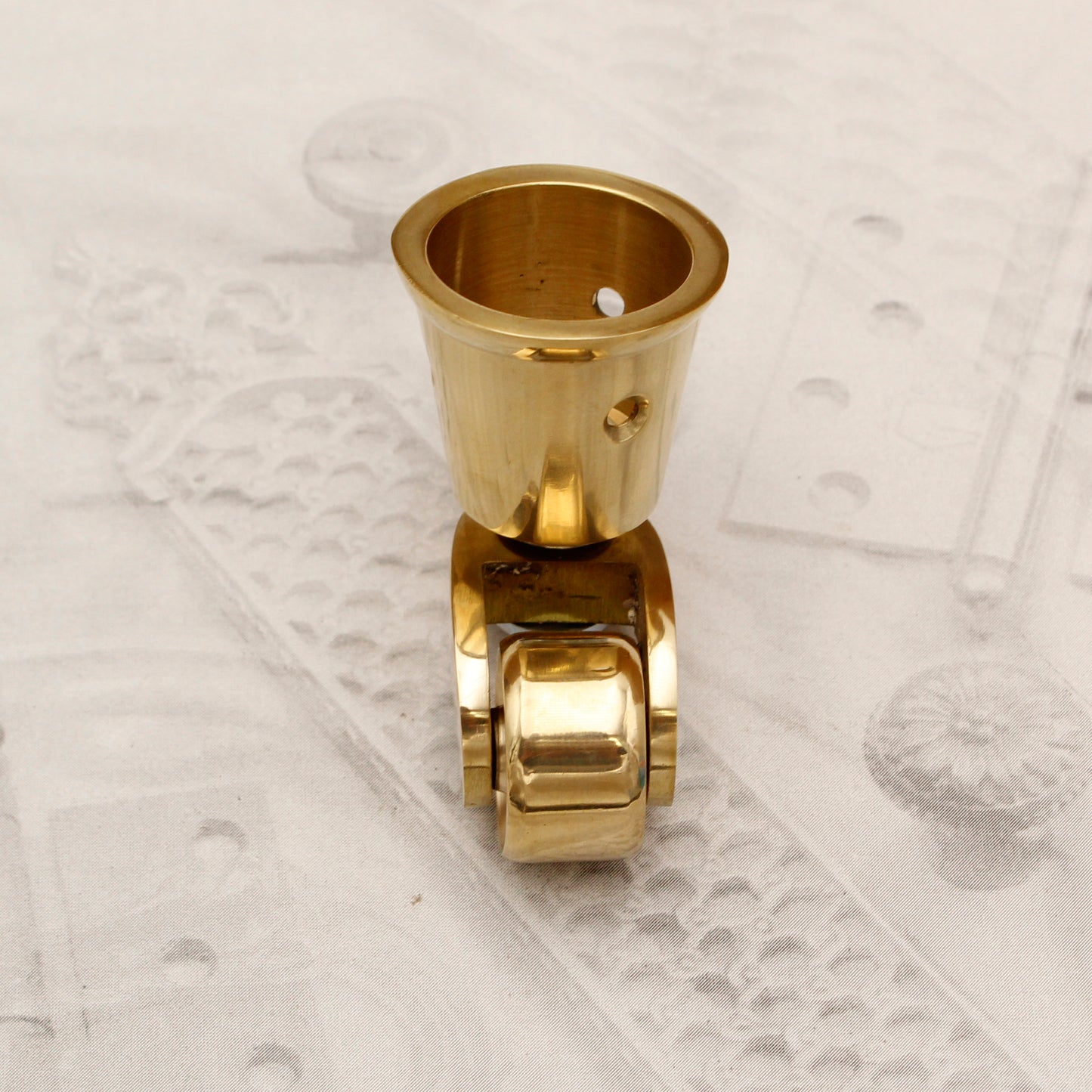 15.128.302 BRASS CASTER