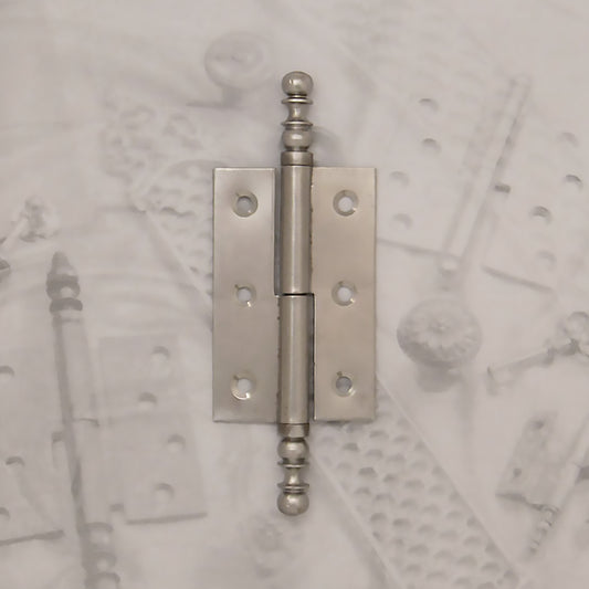 Decorative hardware hinge with finials