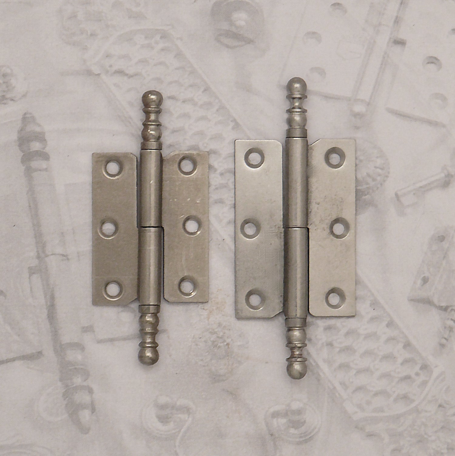 Decorative hardware hinge with finials