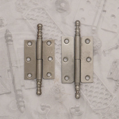 Decorative hardware hinge with finials